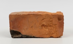 CONVICT BRICK with attached note "Hand Made Convict Brick From House Jos. Lyons, Aust. P.M. In Stanley Tas.", 23cm wide