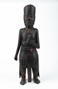 A Javanese figural statue, carved wood with monochrome finish, early to mid 20th century, 57cm high