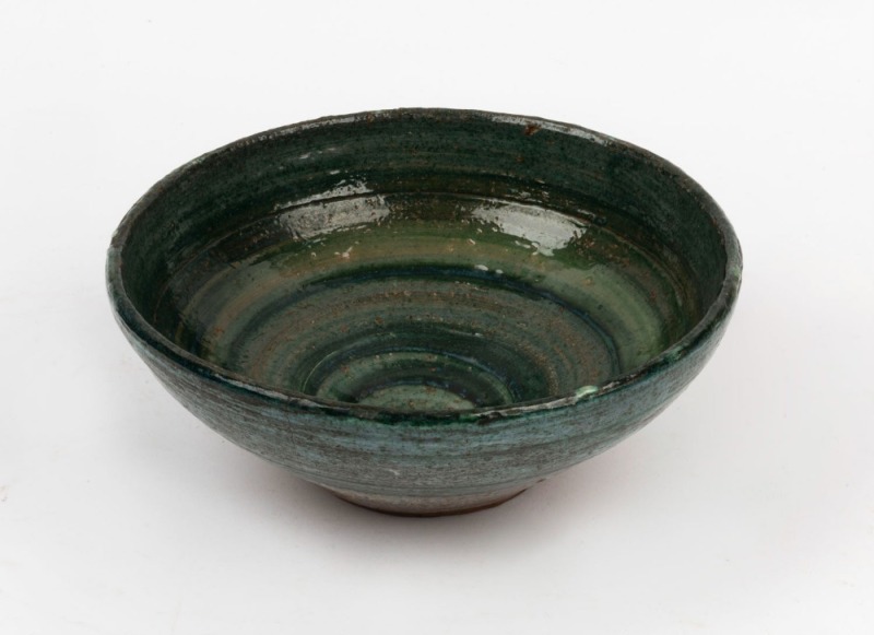 TRUDY FRY studio pottery bowl with swirling green glaze, signed "T.F.", ​​​​​​​9cm high, 23cm diameter