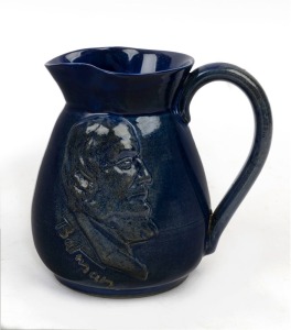 REMUED "BATMAN, MELBOURNE CENTENARY", pottery jug with rare blue glaze, incised "Remued", 12.5cm high