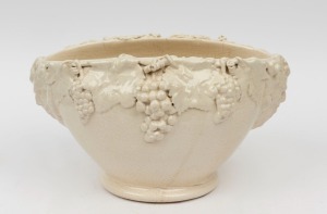 UNA DEERBON cream glazed pottery vase with applied grapes and leaves with facemask handles, incised "Una Deerbon", 19cm high, 33cm wide