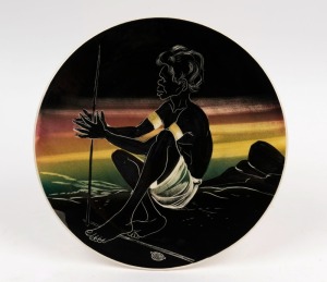 THE LITTLE POTTERY circular wall plaque of an Aborigine lighting a fire, stamped "The Little Pottery, Australia", 29.5cm diameter