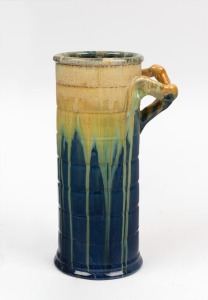 REMUED blue glazed cylindrical pottery vase with applied branch handle, incised "Remued 145/9", 22.5cm high