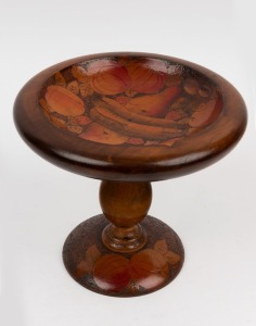 An Australian huon pine poker work compote adorned with fruit, circa 1930, ​​​​​​​22cm high, 24cm diameter