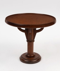 An antique Australian blackwood shop display stand, early 20th century, bearing ink stamp "Manufactured By E. STEWART Cabinet Maker, Coburg, European Labour Only", 22cm high, 24.5cm diameter