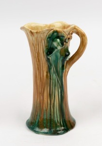 FLORENZ pottery jug with applied gumnuts, leaves and branch handle, incised "Florenz", 19cm high
