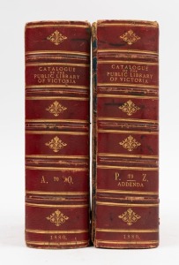 "Catalogue Of The Public Library Of Victoria" 2 vol. full red morocco with embossed gilt lettering to the spines and pictorial boards, [published in 1880], complete but fair condition only, vol.2 front board detached, both scuffed.