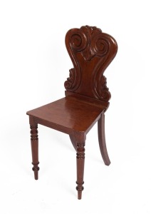 A Colonial cedar hall seat, scroll and acanthus leaf carved back rest with baluster and ring turned front legs, circa 1850. (after a design by Loudon 1833) 86cm high, 39cm across the seat
