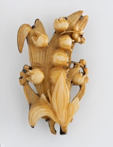 A lily of the valley brooch, carved ivory in sterling silver mount, stamped "STG. CADBY", 5cm high