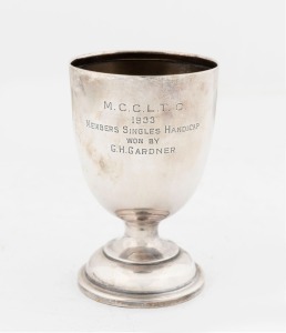 T. GAUNT & Co. Australian silver trophy cup awarded to "M.C.C.L.T.C. 1933 MEMBERS SINGLES HANDICAP WON BY G.H. GARDNER", stamped "T. Gaunt, Sterling Silver", 13cm high, 120 grams