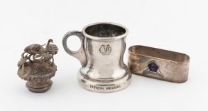 An antique Australian silver emu and fern bottle lid, together with a silver plated spirit measure stamped "BOOMERANG PLATE, STOKES & SONS, MELBOURNE", and a napkin ring, 19th and 20th century, (3 items), the measure 5.5cm high