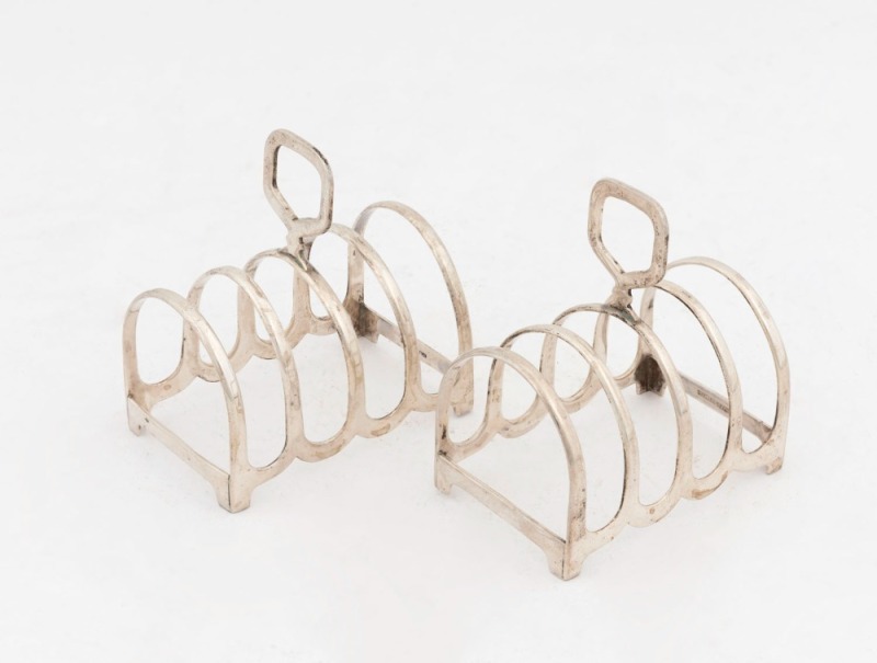 WILLIAM DRUMMOND pair of Australian sterling silver toast racks, early 20th century, stamped "Wm. Drummond & Co. Melbourne", ​​​​​​​7.5cm high, 103 grams total