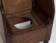 An early primitive Australian winged armchair/commode in the Georgian style, cedar and eucalyptus, Tasmanian origin, circa 1830s, purchased from Evandale antiques in 1977, 109cm high, 57cm across the arms. Illustrated in "Nineteenth Century Australian Fur - 3