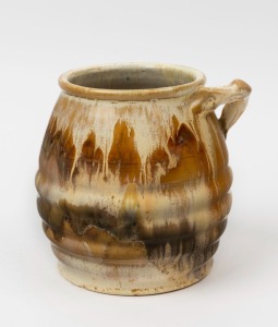 REMUED brown glazed pottery vase with applied branch handle, incised "Remued 142", 15cm high