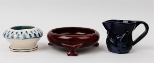 HARVEY SCHOOL burgundy glazed pottery bowl, together with a blue glazed pottery jug, and a blue and white glazed pottery bowl, (3 items), the burgundy bowl 18cm wide