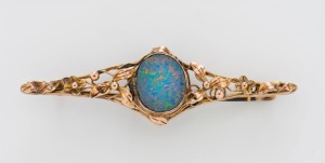 An Art Nouveau 9ct gold and opal doublet bar brooch, early 20th century, 5.7cm wide, 4 grams total