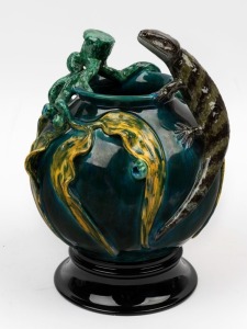 DAVID LYONS studio pottery vase with applied lizard, gumnuts, leaves and branches, with separate pottery plinth, incised "D.C. Lyons, Eastern Blue tongue, Australia, 1/1" with oval impressed stamp. 26.5cm high