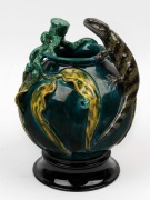 DAVID LYONS studio pottery vase with applied lizard, gumnuts, leaves and branches, with separate pottery plinth, incised "D.C. Lyons, Eastern Blue tongue, Australia, 1/1" with oval impressed stamp. 26.5cm high