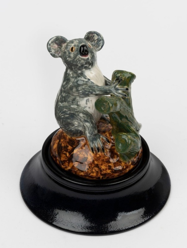 DAVID LYONS studio pottery koala statue, with separate pottery plinth, incised "D.C. Lyons, Australia, 1/1" with oval impressed stamp. 14cm high overall