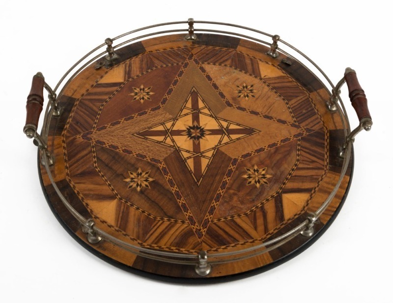 An Australian circular specimen wood circular serving tray, Queensland origin, circa 1920, 40cm across the handles