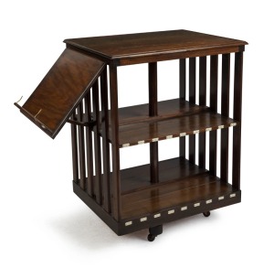 An antique Australian blackwood revolving bookcase with folding bookrest, circa 1900, 90cm high, 68cm wide, 55cm deep