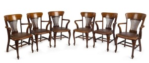 W.H. ROCKE & Co. (attributed), "Commercial Traveller's Association Club", fine set of six armchairs, five of which are beautifully crafted in solid fiddleback blackwood, the other in oak and most likely an earlier English version from which the rest are modeled. 55cm across the arms