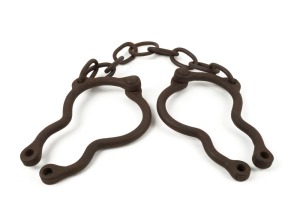 TOP IRONS, antique riveted examples, used as extra punishment over conventional leg irons, hence the phrase "double ironed", 19th century, 80cm long