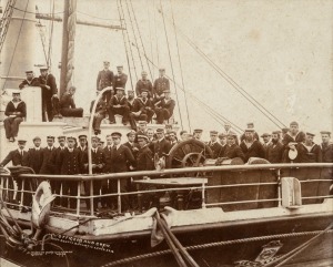 RICHARD WALTER HILLSDON, Photographer, Lyttelton, New Zealand, sepia photographic print dated 26/11/10, laid down on card, titled "OFFICERS AND CREW CAPT. SCOTT'S ANTARCTIC EXPED.1910" depicting the men in full uniform on board the 'Terra Nova' prior to d