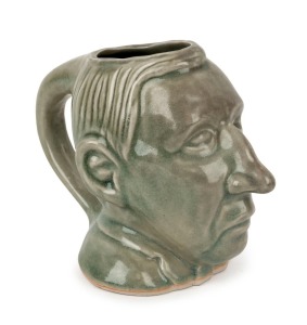 PAUL KEATING pottery character jug, late 20th century, 14cm high, 17cm wide