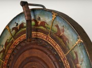 AN ANTIQUE AUSTRALIAN HORSE RACING WHEEL-OF-CHANCE A wheel-of-chance depicting twelve different Australian racehorses, painted and titled in oil paint on cedar, the wheel surrounded by brass strapping and mounted on a later stand; the wheel circa 1890. Ov - 2