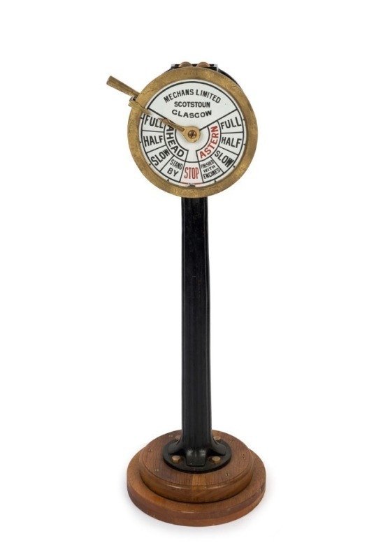 A ship's telegraph, cast iron, brass and enamel dial with bells, made by "MECHANS LIMITED, SCOTSTOUN, GLASGOW", 19th/20th century, 108cm high