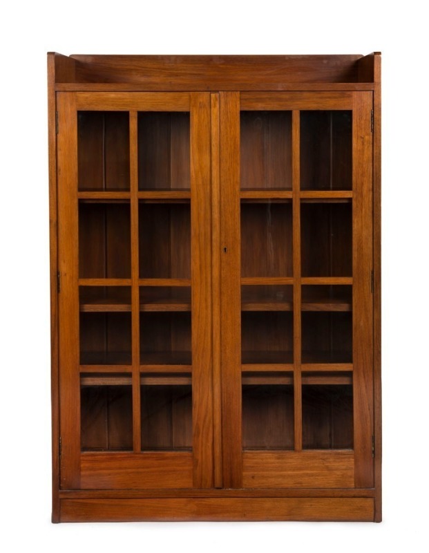 BUCKLEY & NUNN Australian Arts & Crafts solid blackwood bookcase, early 20th century, retailer's plaque inside the door, 139cm high, 92cm wide, 30cm deep