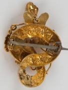 An antique Australian Colonial yellow gold brooch, set with red stones, circa 1860s, 3.5cm high, 3.2 grams - 3