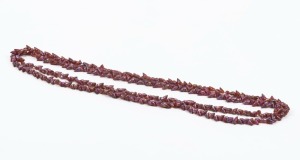 A mariner shell bead necklace with pink stain, 164cm long