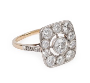 A stunning Art Deco diamond plaque ring set in yellow gold and platinum, featuring a central diamond of approximately .6ct surrounded by approximately 2ct (total) of white diamonds