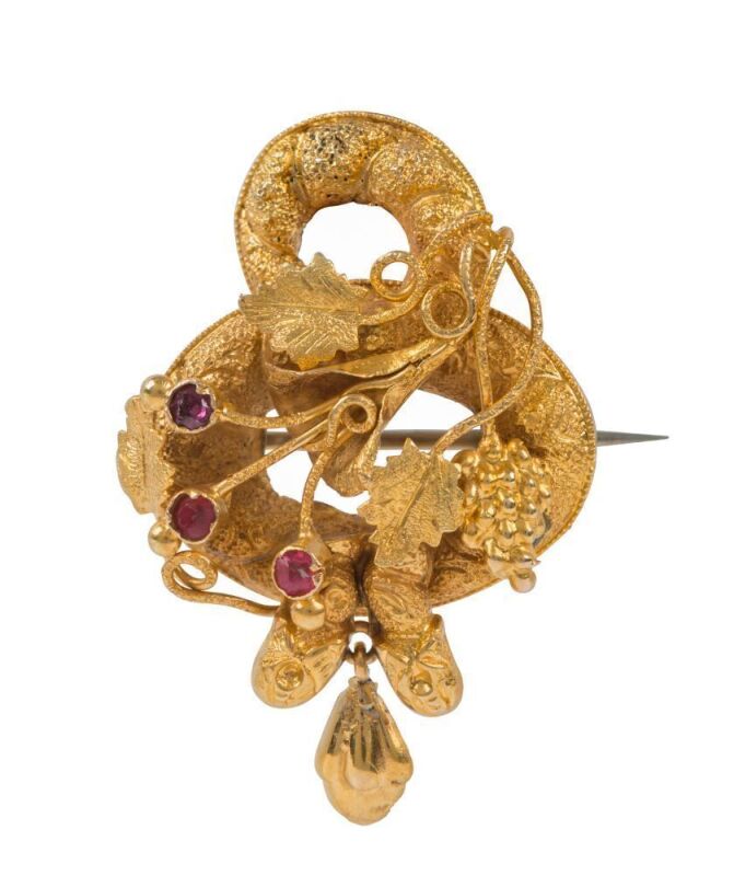 An antique Australian Colonial yellow gold brooch, set with red stones, circa 1860s, 3.5cm high, 3.2 grams