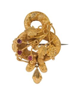 An antique Australian Colonial yellow gold brooch, set with red stones, circa 1860s, 3.5cm high, 3.2 grams