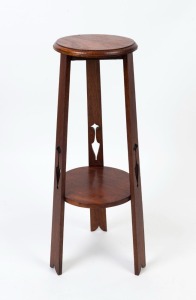 An Australian Arts and Crafts jardiniere stand, Queensland maple, circa 1910, 85cm high, 32cm diameter