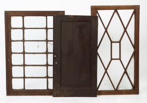 Three antique Australian cedar furniture or cabinet doors, two 1820s Tasmanian examples with astragal glazing, the other a solid fielded panel example, 19th century, 95 x 64cm, 100.5 x 52.5cm and 90 x 48cnm