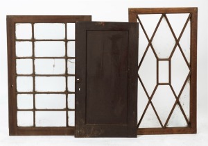 Three antique Australian cedar furniture or cabinet doors, two 1820s Tasmanian examples with astragal glazing, the other a solid fielded panel example, 19th century, ​​​​​​​95 x 64cm, 100.5 x 52.5cm and 90 x 48cnm