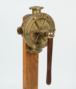 An antique ship's bilge pump, SIMAC No.V, 19th/20th century, mounted on later wooden stand, 106cm high overall