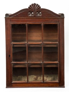 An antique cedar wall cabinet with carved pediment top, Launceston, Tasmanian origin, circa 1840, 95cm high, 61cm wide, 29cm deep