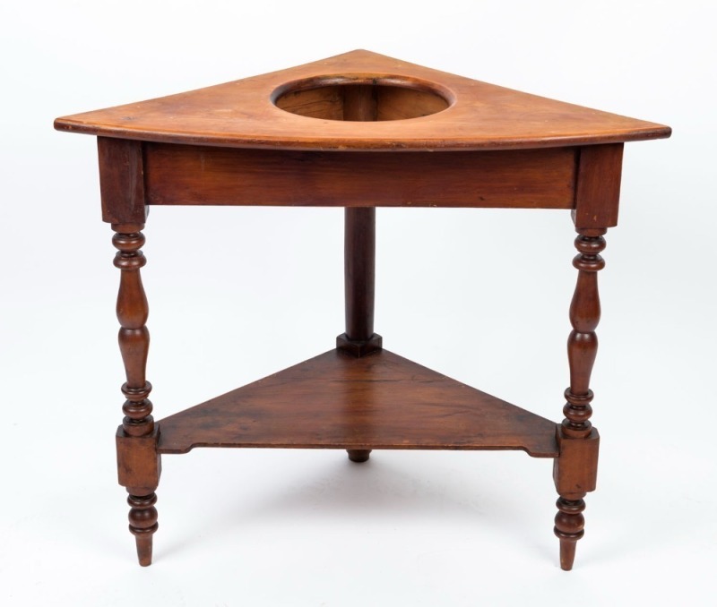 An antique huon pine corner washstand, 19th century, ​​​​​​​76cm high, 87cm wide, 51cm deep