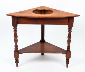 An antique huon pine corner washstand, 19th century, 76cm high, 87cm wide, 51cm deep