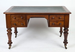 An antique Australian cedar kneehole desk with baluster legs, inset leather top and four drawers, 19th century, 75cm high, 122cm wide, 67cm deep