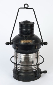 An antique ship's lantern with black painted finish and applied brass plaque "ANCHOR", 19th/20th century, 58cm high including handle