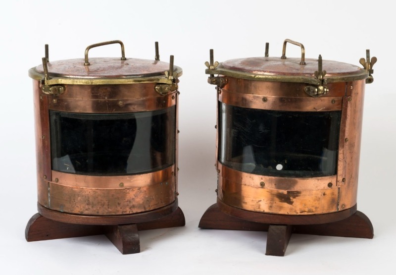 A pair of antique copper and brass round running lamps, 19th/20th century, mounted on later wooden bases, 39cm high, 35cm wide each overall