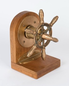 A trawler ship's wheel mounted on later timber stand, 20th century, the wheel 29cm wide, 35cm high overall
