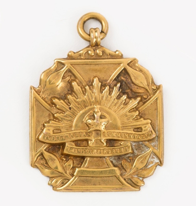 AUSTRALIAN COMMONWEALTH MILITARY FORCES: 9ct gold fob badge presented to "Pte A. Shipton by the residents of Rooty Hill District"; weight 6gr.