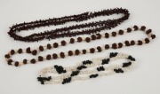 Three assorted apple seed and shell bead necklaces, 20th century, the largest 140cm long